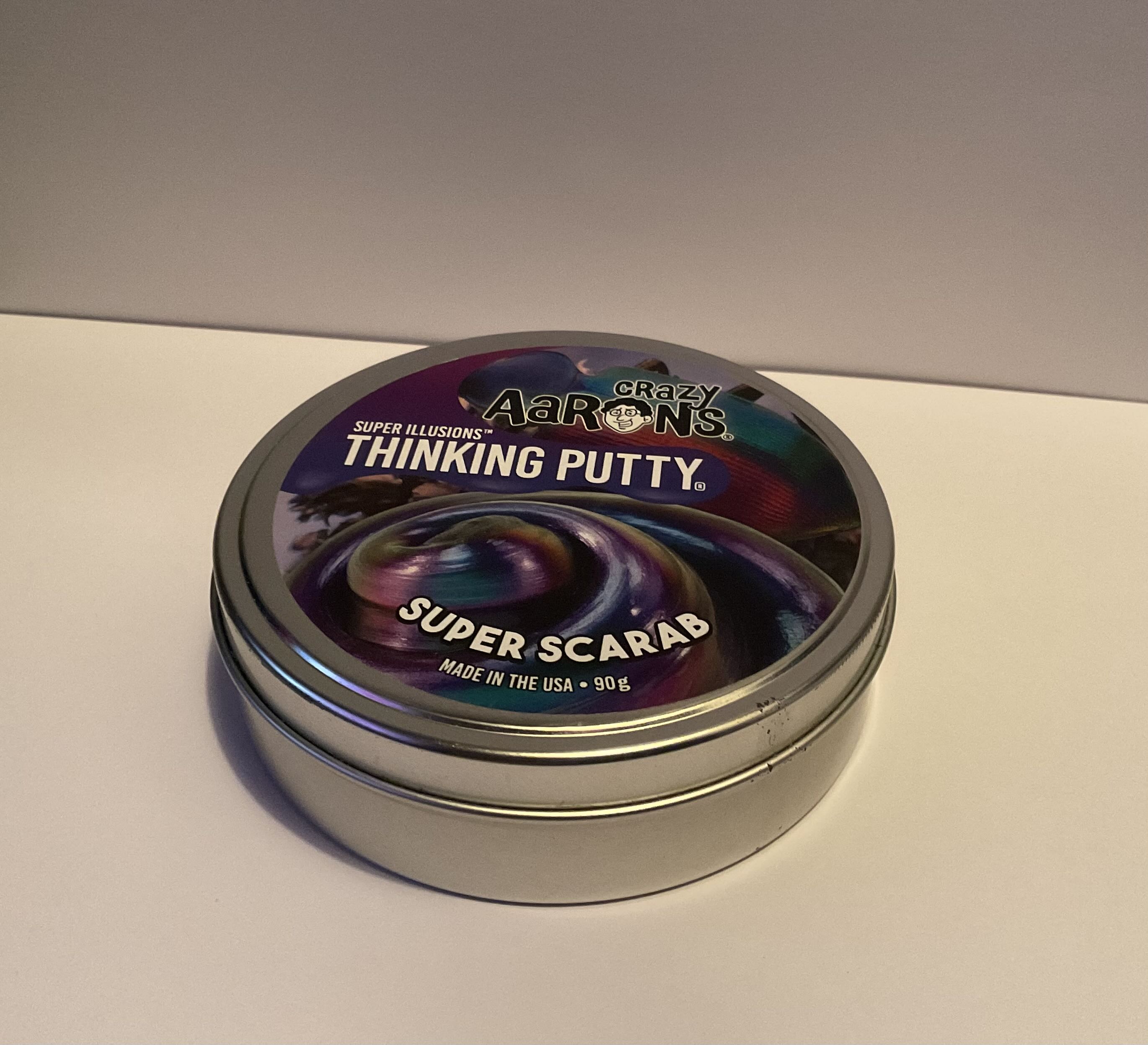 When I get bored I play with the putty inside of this tin as something to keep my hands busy.