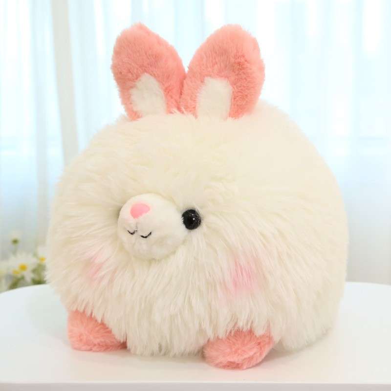 A cute fluffy rabbit plush with different textures of fur on it.
